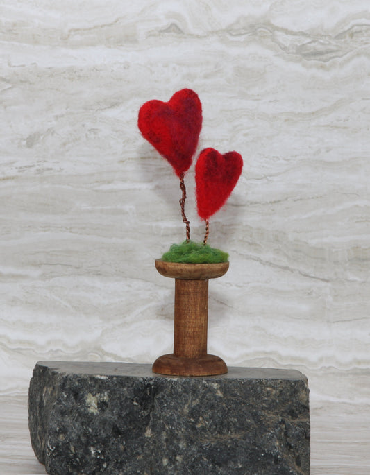 Felted hearts duo on bobbin