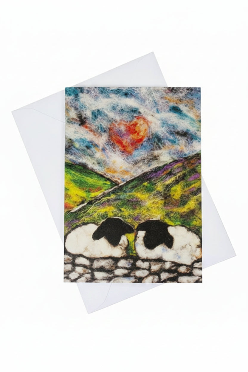 A square greeting card featuring a textured, folk-art style landscape with sheep on a stone wall under a cloudy sky 